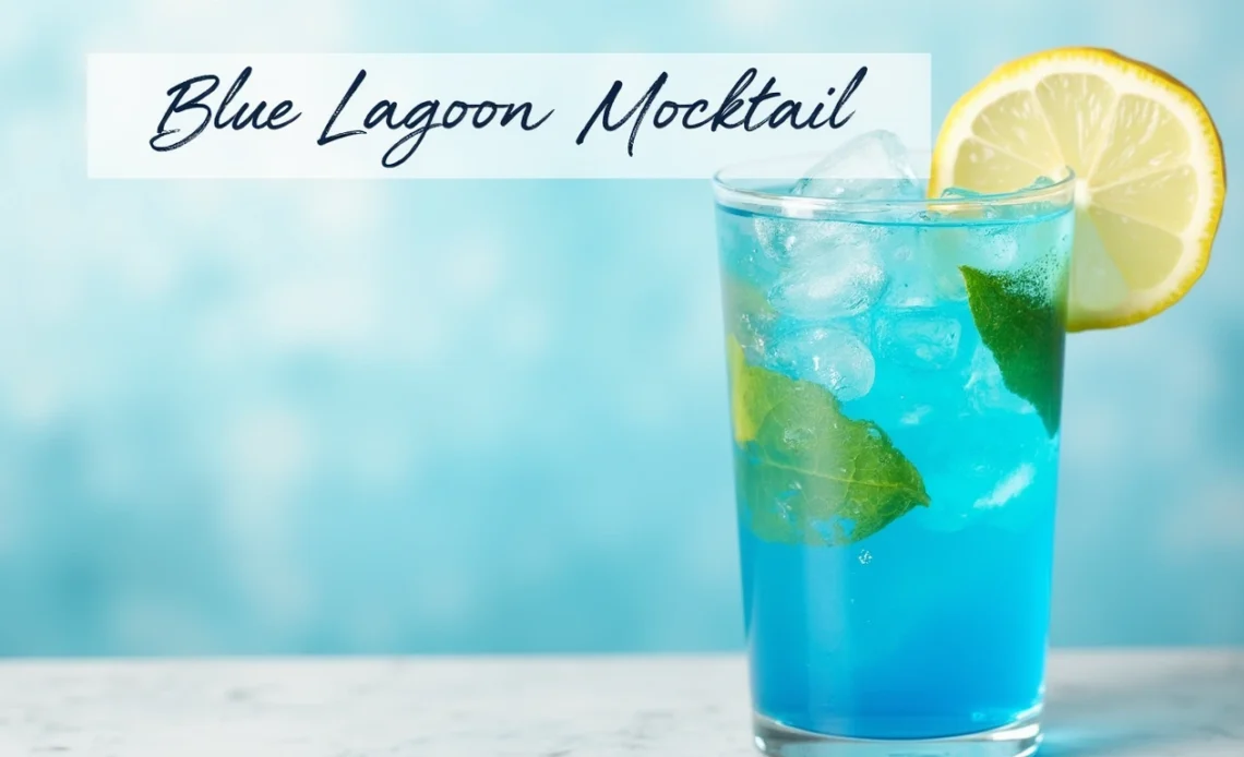A refreshing Blue Lagoon mocktail served in a tall glass, garnished with a lemon slice and a cherry, with ice cubes floating in the vibrant blue drink.