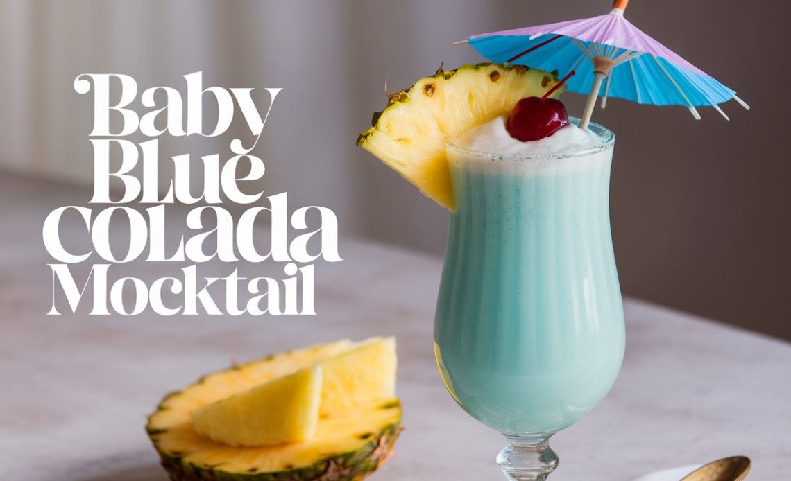 A refreshing Baby Blue Colada Mocktail in a tall glass, garnished with a slice of pineapple, a cherry, and a small umbrella, served over ice.