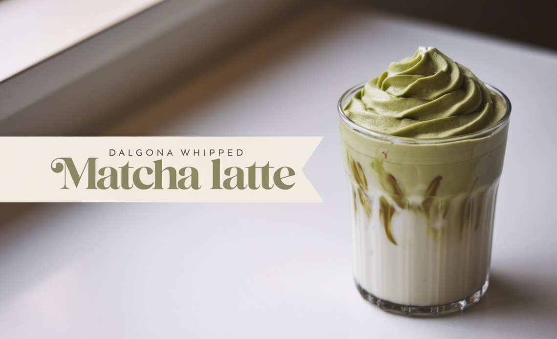 A layered Dalgona whipped matcha latte in a clear glass, featuring fluffy green matcha foam on top of chilled milk with ice cubes.