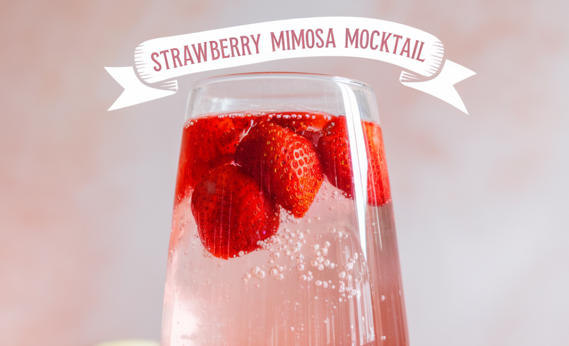 A refreshing strawberry mimosa mocktail served in a flute glass, garnished with a fresh strawberry slice, and sparkling with bubbles.