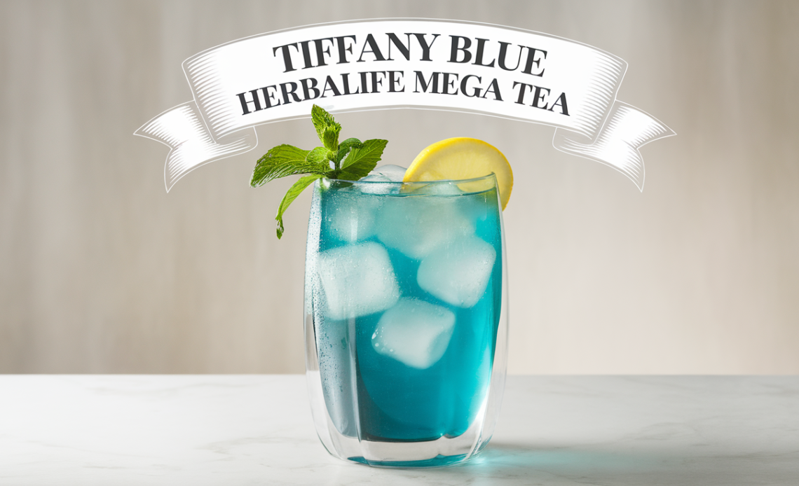 A vibrant glass of Tiffany Blue Herbalife Mega Tea, garnished with a slice of lemon and a sprig of mint, served over ice with a colorful straw.